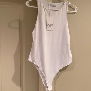 Zara white sleeveless body suit.